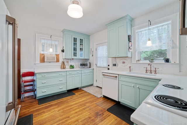 135 Park Ter, Waterbury, CT 06708 - kitchen with dishwasher, light wood-style flooring, decorative light fixtures, and light countertops