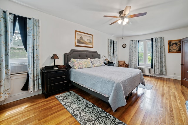 135 Park Ter, Waterbury, CT 06708 - bedroom featuring radiator heating unit, wood finished floors, and ceiling fan
