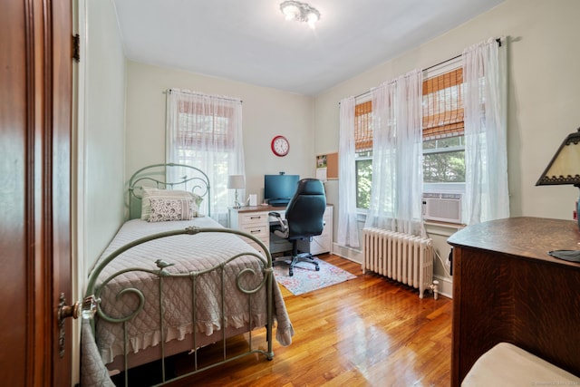 135 Park Ter, Waterbury, CT 06708 - bedroom featuring radiator, a desk, wood finished floors, and cooling unit