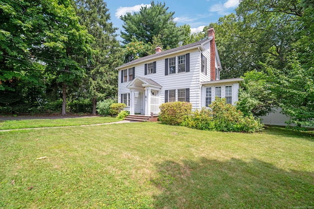 135 Park Ter, Waterbury, CT 06708 - colonial home featuring a chimney and a front yard