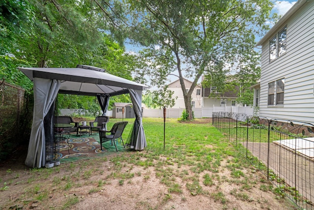 135 Park Ter, Waterbury, CT 06708 - fenced backyard with a gazebo, a storage unit, and a patio