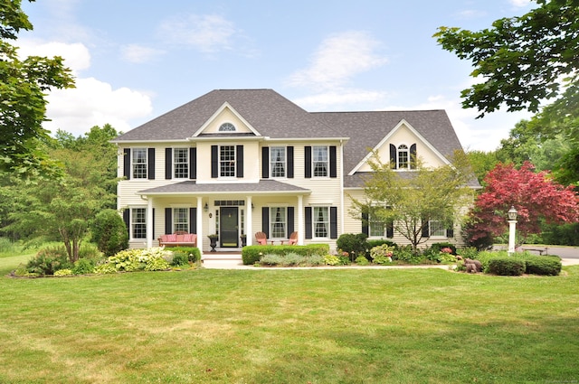 190 Shadow Pond, Suffield, CT 06078 - colonial inspired home with a porch, a front lawn, and a shingled roof