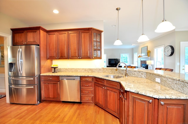 190 Shadow Pond, Suffield, CT 06078 - kitchen with stainless steel appliances, light wood finished floors, crown molding, light stone countertops, and a peninsula