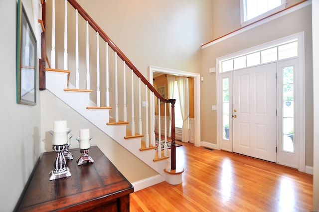 190 Shadow Pond, Suffield, CT 06078 - entryway featuring wood finished floors, a towering ceiling, and stairway