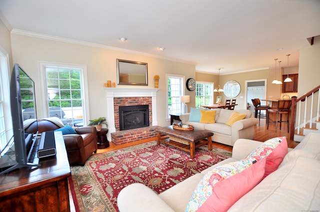 190 Shadow Pond, Suffield, CT 06078 - living area with wood finished floors, crown molding, a fireplace, and stairway
