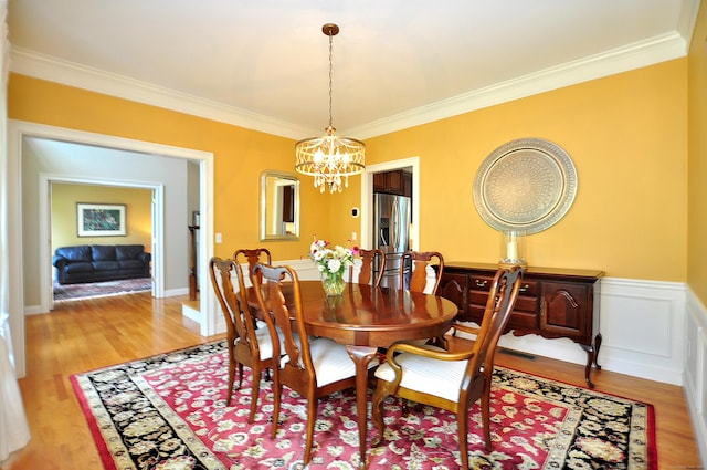190 Shadow Pond, Suffield, CT 06078 - dining room with a chandelier, crown molding, and light wood finished floors