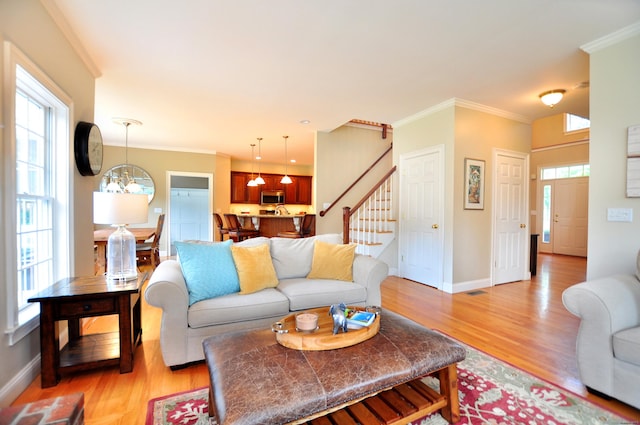 190 Shadow Pond, Suffield, CT 06078 - living area featuring stairs, light wood-type flooring, and ornamental molding