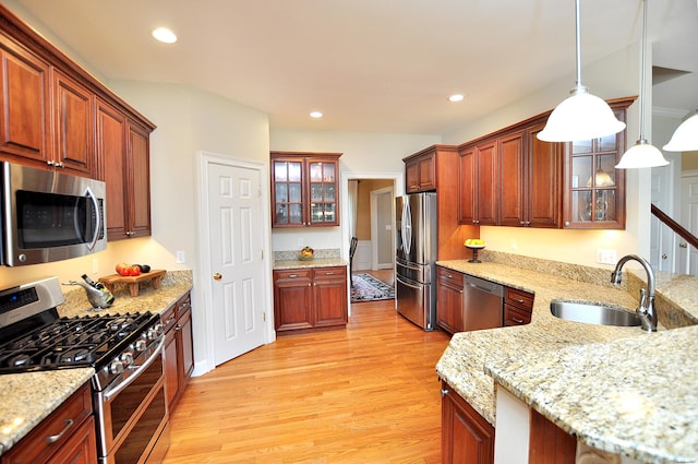190 Shadow Pond, Suffield, CT 06078 - kitchen featuring appliances with stainless steel finishes, light wood-style floors, pendant lighting, glass insert cabinets, and recessed lighting