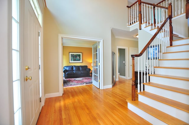 190 Shadow Pond, Suffield, CT 06078 - foyer entrance with crown molding, stairway, wood finished floors, and a high ceiling