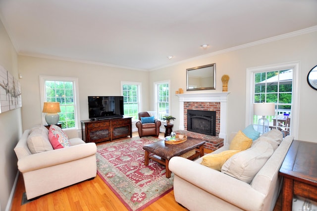 190 Shadow Pond, Suffield, CT 06078 - living area with wood finished floors, plenty of natural light, ornamental molding, and a fireplace
