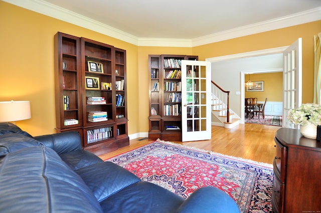 190 Shadow Pond, Suffield, CT 06078 - living area featuring wood finished floors, a chandelier, and crown molding