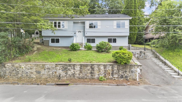 302 Fieldwood Rd, Waterbury, CT 06704 - back of property with entry steps, stairs, and a yard