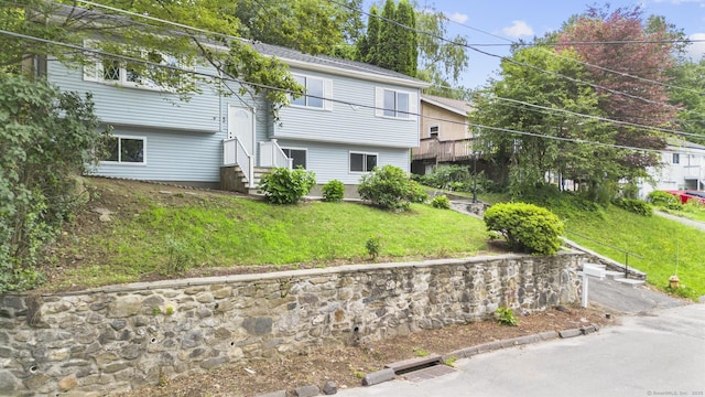 302 Fieldwood Rd, Waterbury, CT 06704 - back of property featuring entry steps and a yard