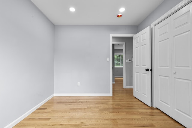 302 Fieldwood Rd, Waterbury, CT 06704 - unfurnished bedroom featuring light wood-type flooring, recessed lighting, and a closet
