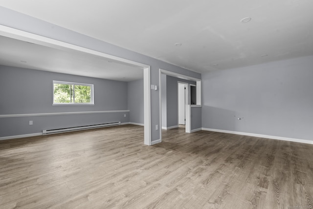 302 Fieldwood Rd, Waterbury, CT 06704 - unfurnished living room featuring a baseboard radiator and wood finished floors