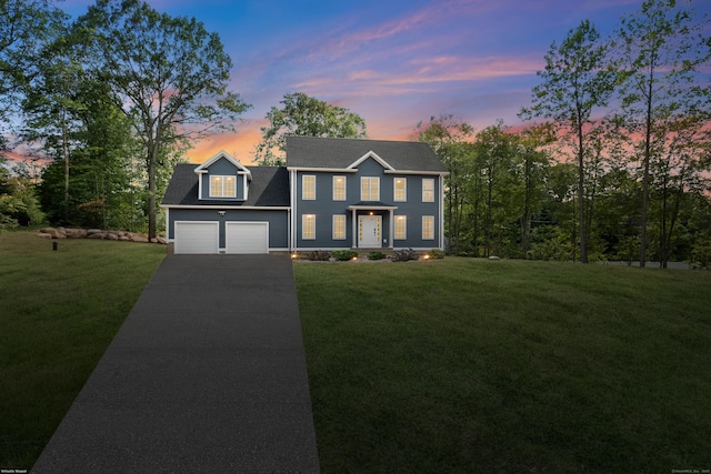 61 N Woods Rd, Hamden, CT 06518 - colonial house with driveway, a garage, and a lawn