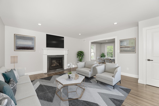 61 N Woods Rd, Hamden, CT 06518 - living area featuring wood finished floors, recessed lighting, and a glass covered fireplace