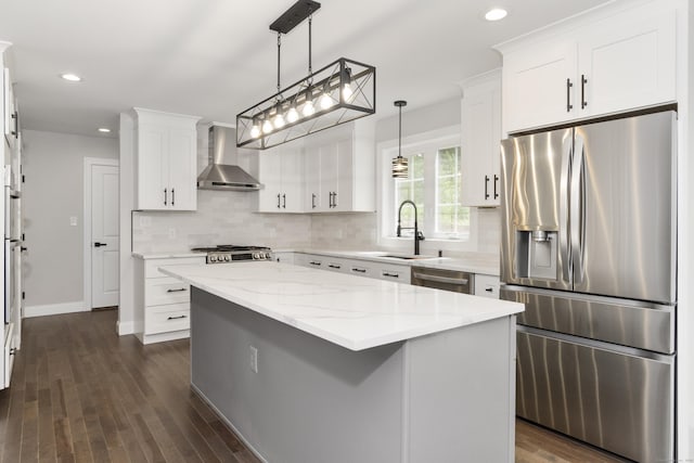 61 N Woods Rd, Hamden, CT 06518 - kitchen with stainless steel appliances, wall chimney exhaust hood, backsplash, recessed lighting, and white cabinetry