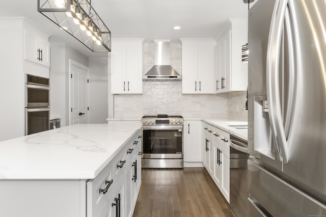 61 N Woods Rd, Hamden, CT 06518 - kitchen with appliances with stainless steel finishes, wall chimney exhaust hood, dark wood finished floors, a kitchen island, and tasteful backsplash