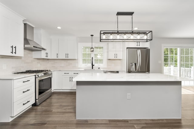 61 N Woods Rd, Hamden, CT 06518 - kitchen featuring stainless steel appliances, wall chimney range hood, recessed lighting, a center island, and dark wood-type flooring