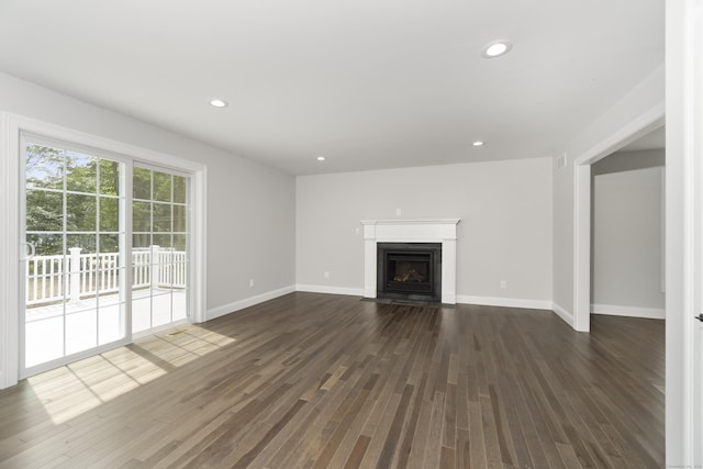 61 N Woods Rd, Hamden, CT 06518 - unfurnished living room featuring dark wood-style floors, recessed lighting, and a fireplace with flush hearth
