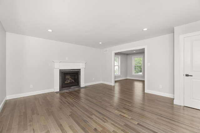 61 N Woods Rd, Hamden, CT 06518 - unfurnished living room featuring wood finished floors, a fireplace with flush hearth, and recessed lighting