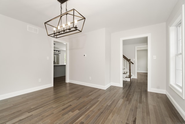 61 N Woods Rd, Hamden, CT 06518 - unfurnished dining area featuring dark wood-style flooring, stairway, and a chandelier