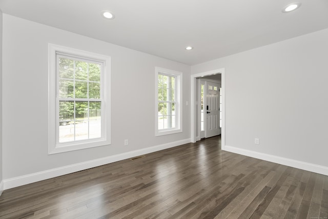 61 N Woods Rd, Hamden, CT 06518 - empty room featuring healthy amount of natural light, dark wood-type flooring, and recessed lighting