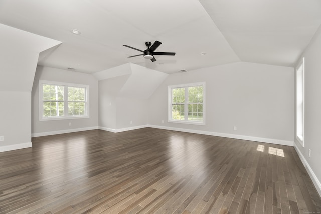 61 N Woods Rd, Hamden, CT 06518 - unfurnished living room featuring dark wood-style floors, lofted ceiling, a ceiling fan, and plenty of natural light