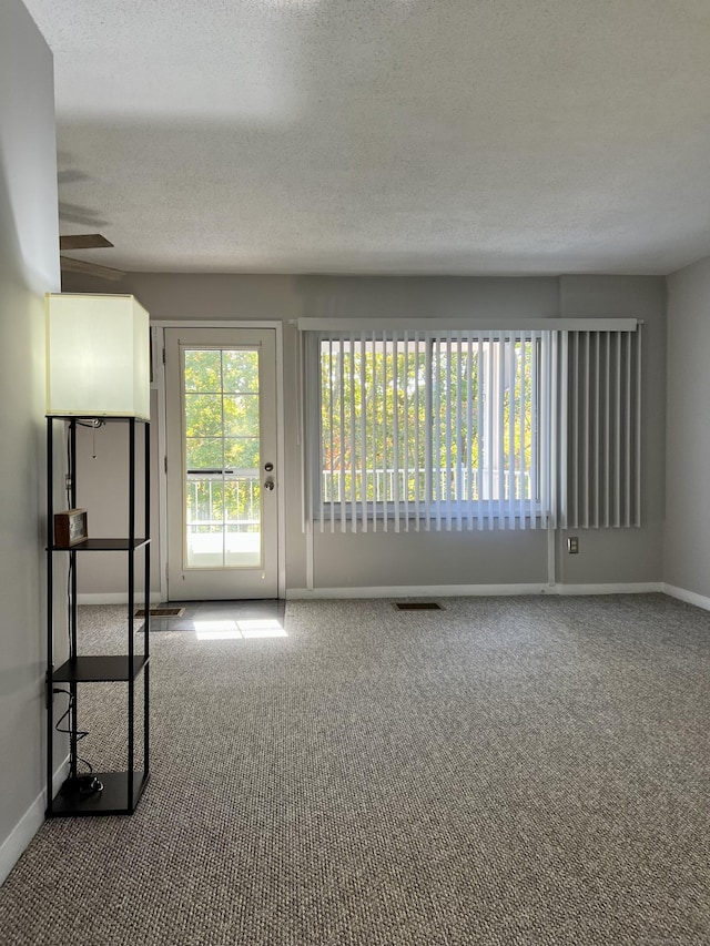 280 Gardner Ave Unit D4, New London, CT 06320 - carpeted spare room with baseboards and a textured ceiling