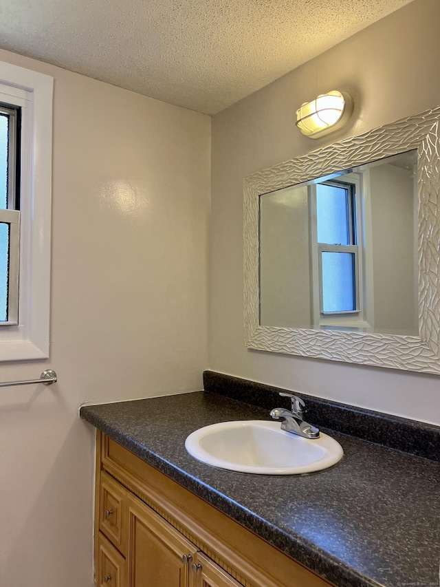 280 Gardner Ave Unit D4, New London, CT 06320 - bathroom with vanity and a textured ceiling