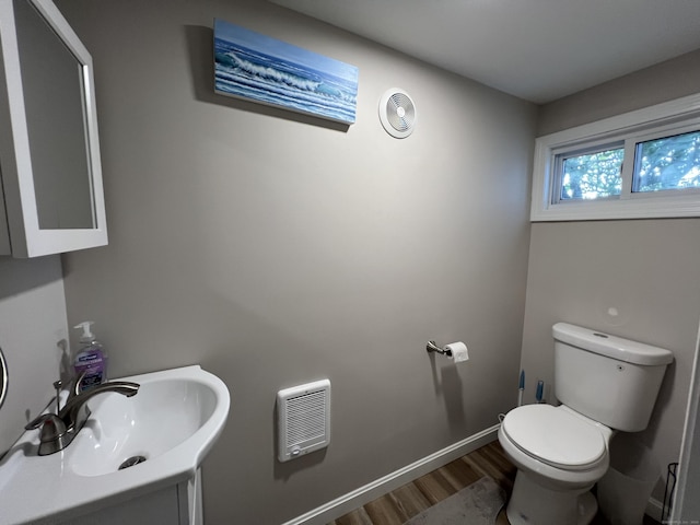 34 Division St, Norwich, CT 06360 - bathroom featuring wood finished floors and vanity
