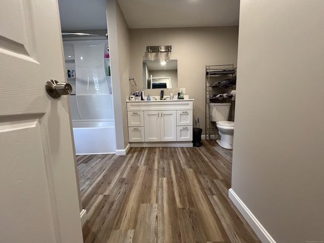 34 Division St, Norwich, CT 06360 - full bathroom with wood finished floors, vanity, and washtub / shower combination