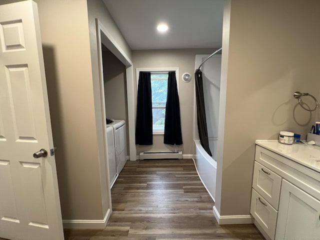 34 Division St, Norwich, CT 06360 - laundry area featuring a baseboard heating unit, dark wood-type flooring, recessed lighting, and washer and clothes dryer