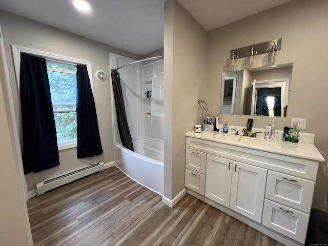 34 Division St, Norwich, CT 06360 - bathroom featuring a baseboard radiator, wood finished floors, vanity, and shower / tub combo