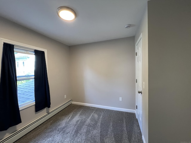34 Division St, Norwich, CT 06360 - unfurnished room with baseboard heating, dark colored carpet, and a smoke detector
