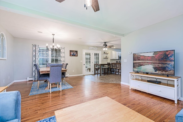 93 Cook Hill Rd, Killingly, CT 06239 - living area with ceiling fan, wood finished floors, a baseboard radiator, and french doors