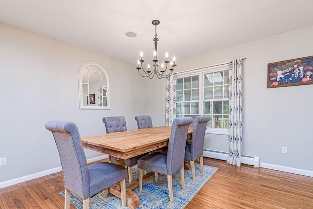 93 Cook Hill Rd, Killingly, CT 06239 - dining space featuring a chandelier, baseboard heating, and wood finished floors