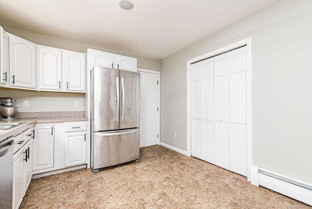 93 Cook Hill Rd, Killingly, CT 06239 - kitchen with stainless steel appliances, baseboard heating, white cabinets, and light countertops
