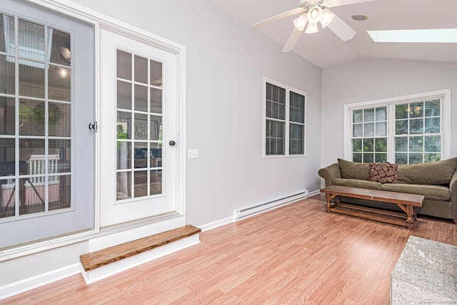 93 Cook Hill Rd, Killingly, CT 06239 - living room featuring baseboard heating, a skylight, a ceiling fan, wood finished floors, and lofted ceiling