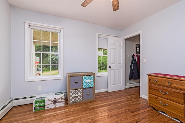93 Cook Hill Rd, Killingly, CT 06239 - bedroom featuring baseboard heating, wood finished floors, and a ceiling fan
