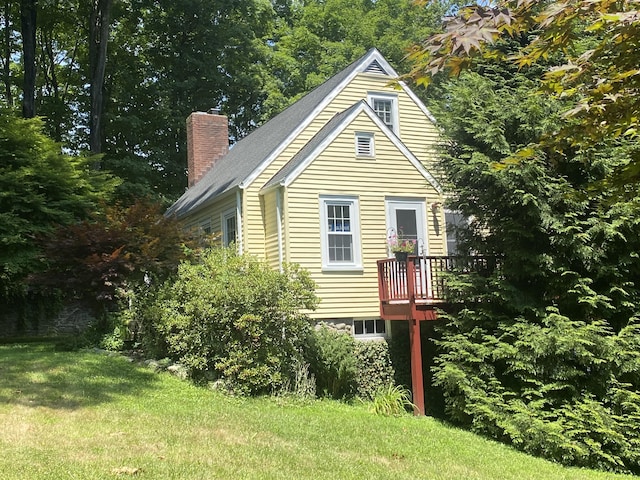 29 Grumman Ave, Wilton, CT 06897 - view of front of house featuring a chimney, a front lawn, and a deck