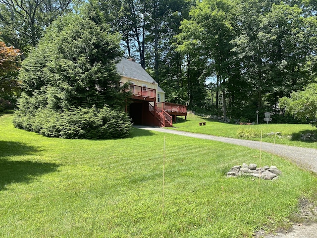 29 Grumman Ave, Wilton, CT 06897 - view of green lawn featuring a deck and stairway