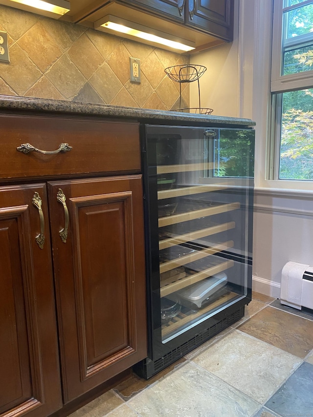 29 Grumman Ave, Wilton, CT 06897 - kitchen view of wine cooler, tasteful backsplash, dark brown cabinetry, and dark countertops