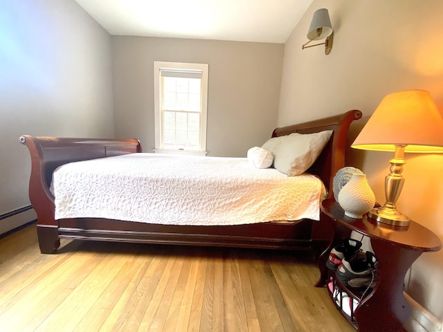 29 Grumman Ave, Wilton, CT 06897 - bedroom with wood finished floors and a baseboard radiator