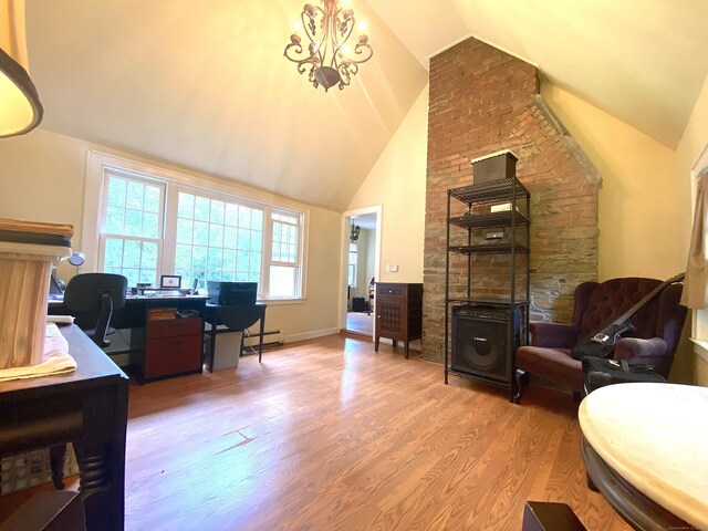 29 Grumman Ave, Wilton, CT 06897 - home office featuring lofted ceiling, wood finished floors, a baseboard radiator, and a fireplace