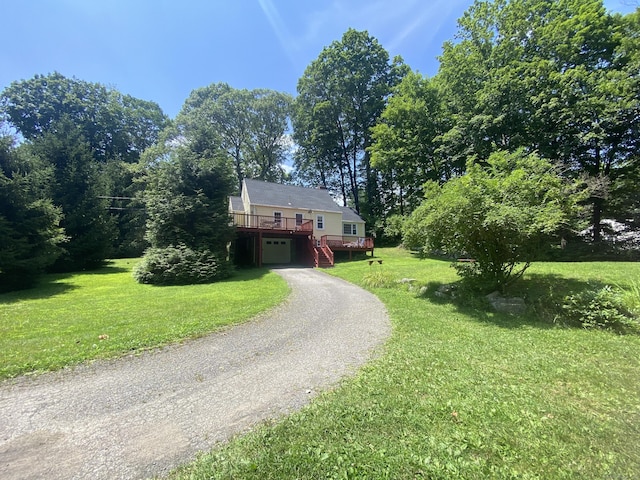 29 Grumman Ave, Wilton, CT 06897 - view of front of home featuring gravel driveway, a wooden deck, a front lawn, stairway, and an attached garage