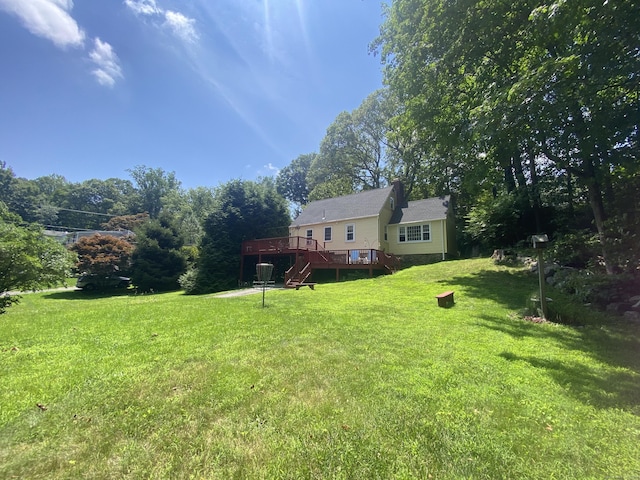29 Grumman Ave, Wilton, CT 06897 - view of green lawn featuring a wooden deck and stairs