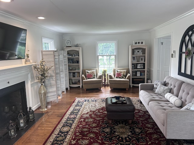 8 Sharon Ln, Old Saybrook, CT 06475 - living area featuring wood finished floors, plenty of natural light, ornamental molding, a fireplace with flush hearth, and recessed lighting