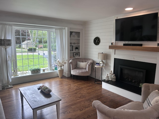 8 Sharon Ln, Old Saybrook, CT 06475 - living room featuring a glass covered fireplace, wood finished floors, recessed lighting, and crown molding